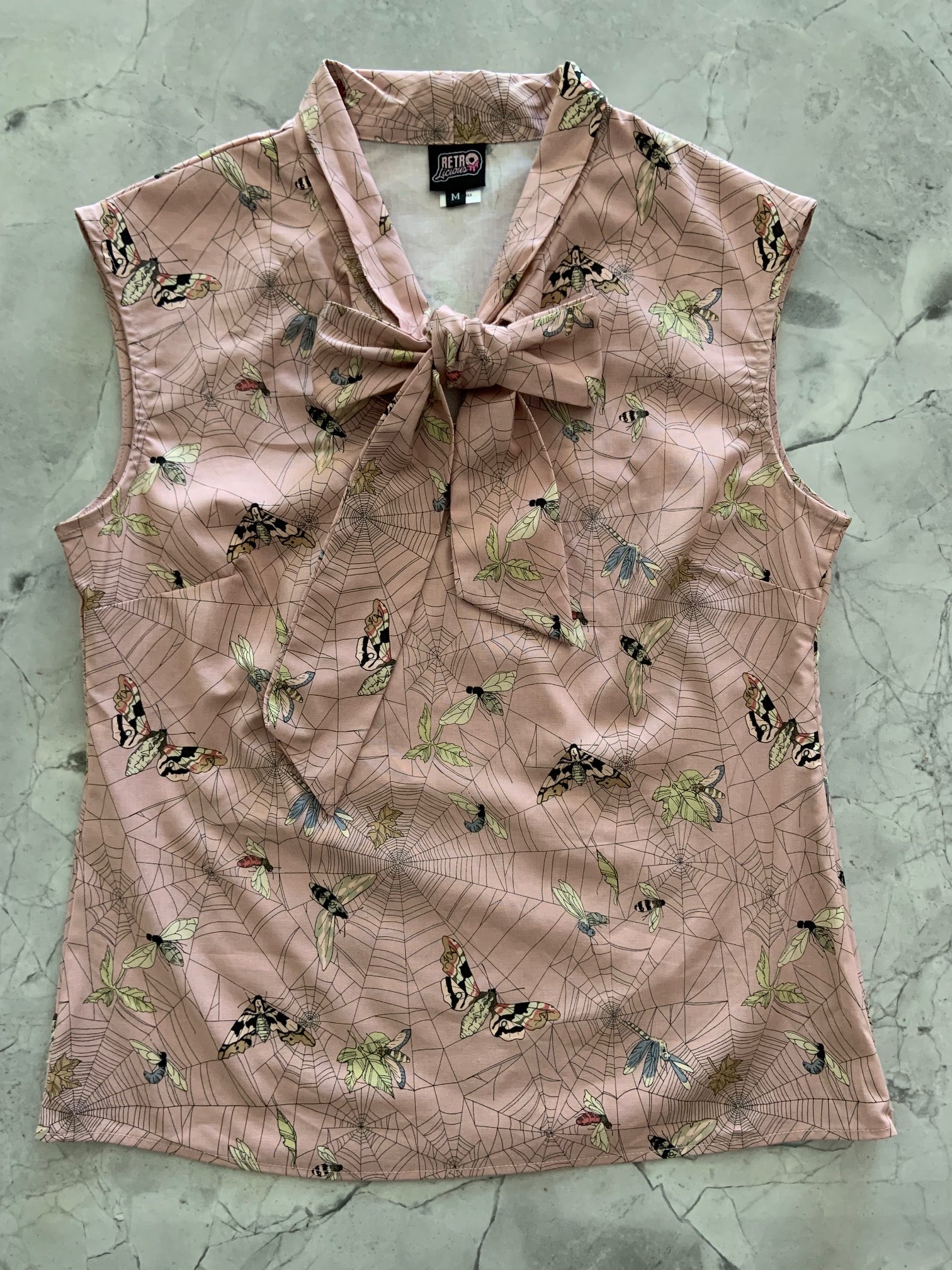 a flat lay image of the front of our moth bow top