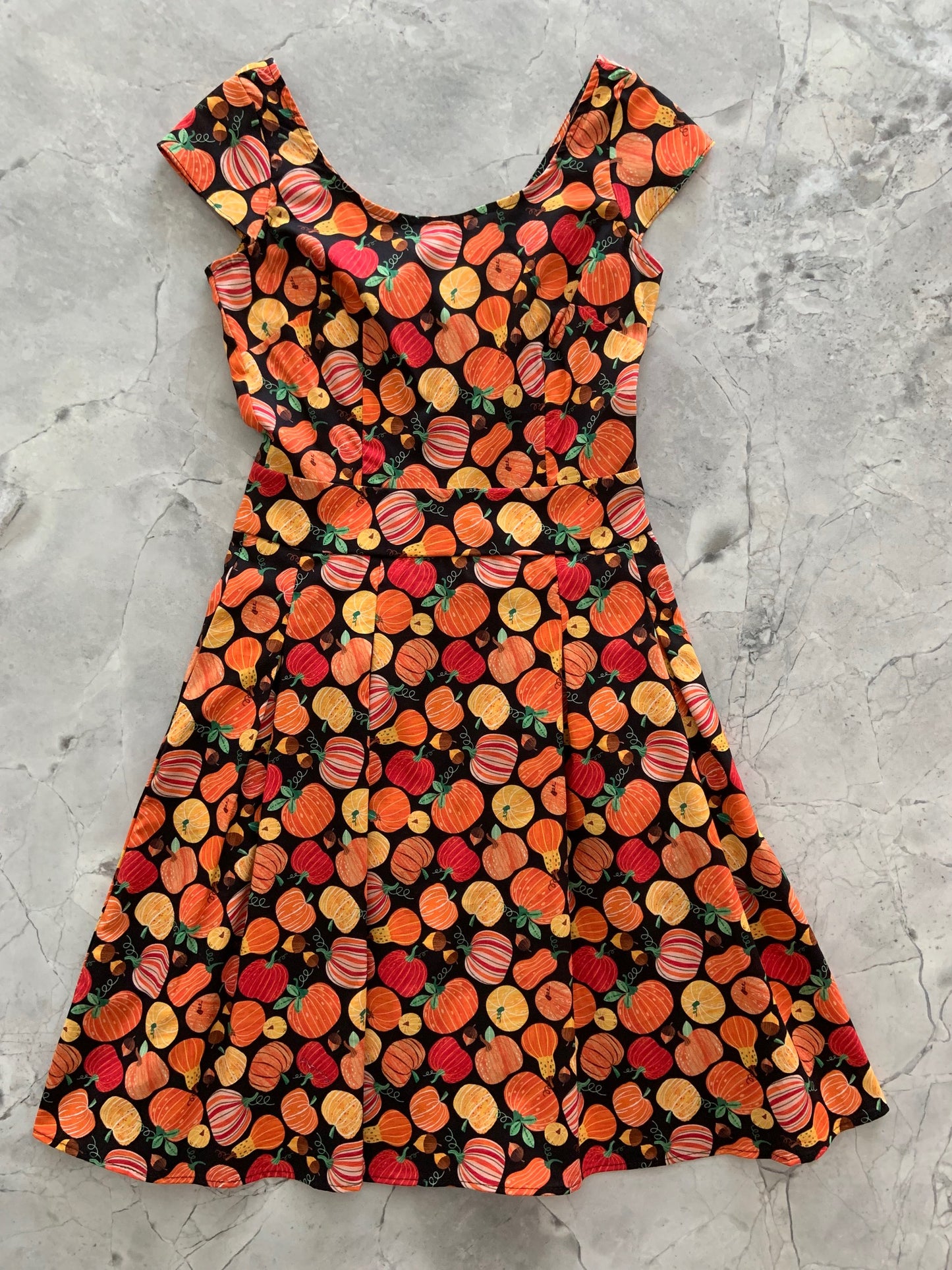 a flat lay of gourdgeous margaret dress