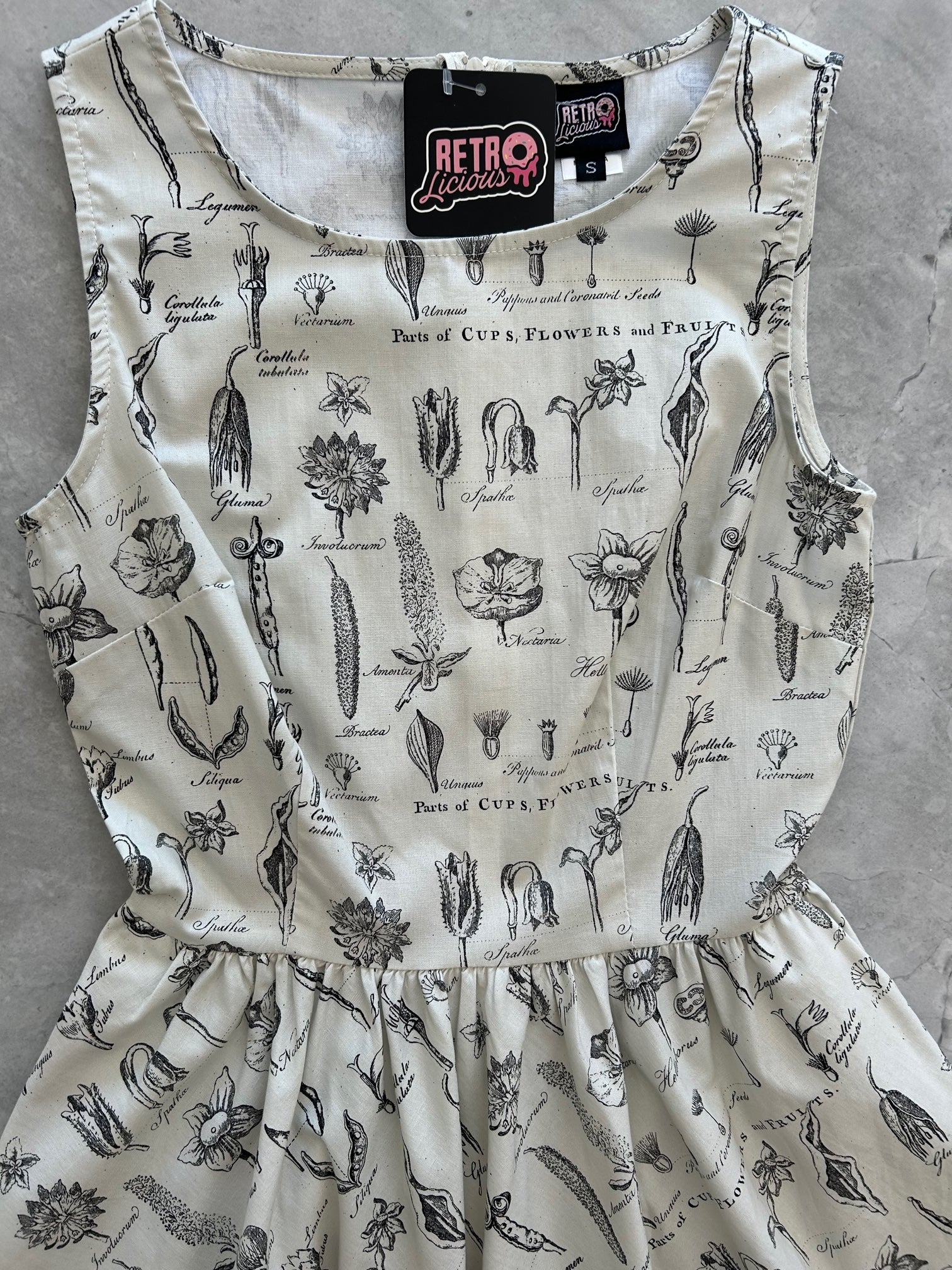 a flat lay of the front of the bodice of the flower parts vintage dress