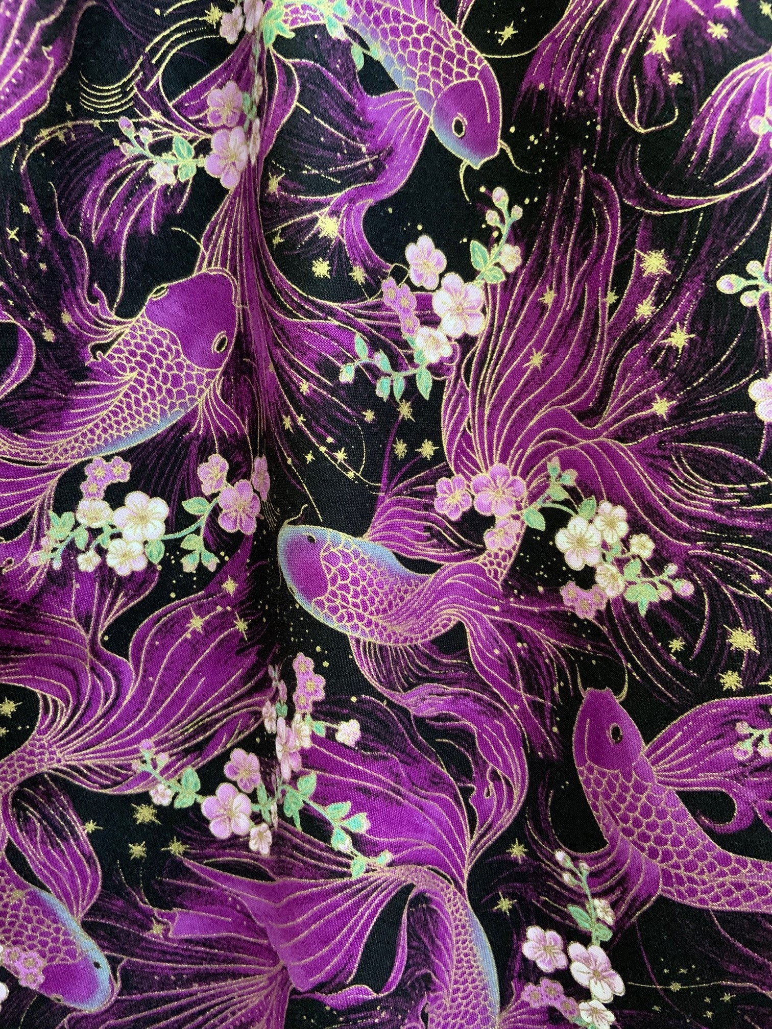 a close up fabric of koi fish vintage dress