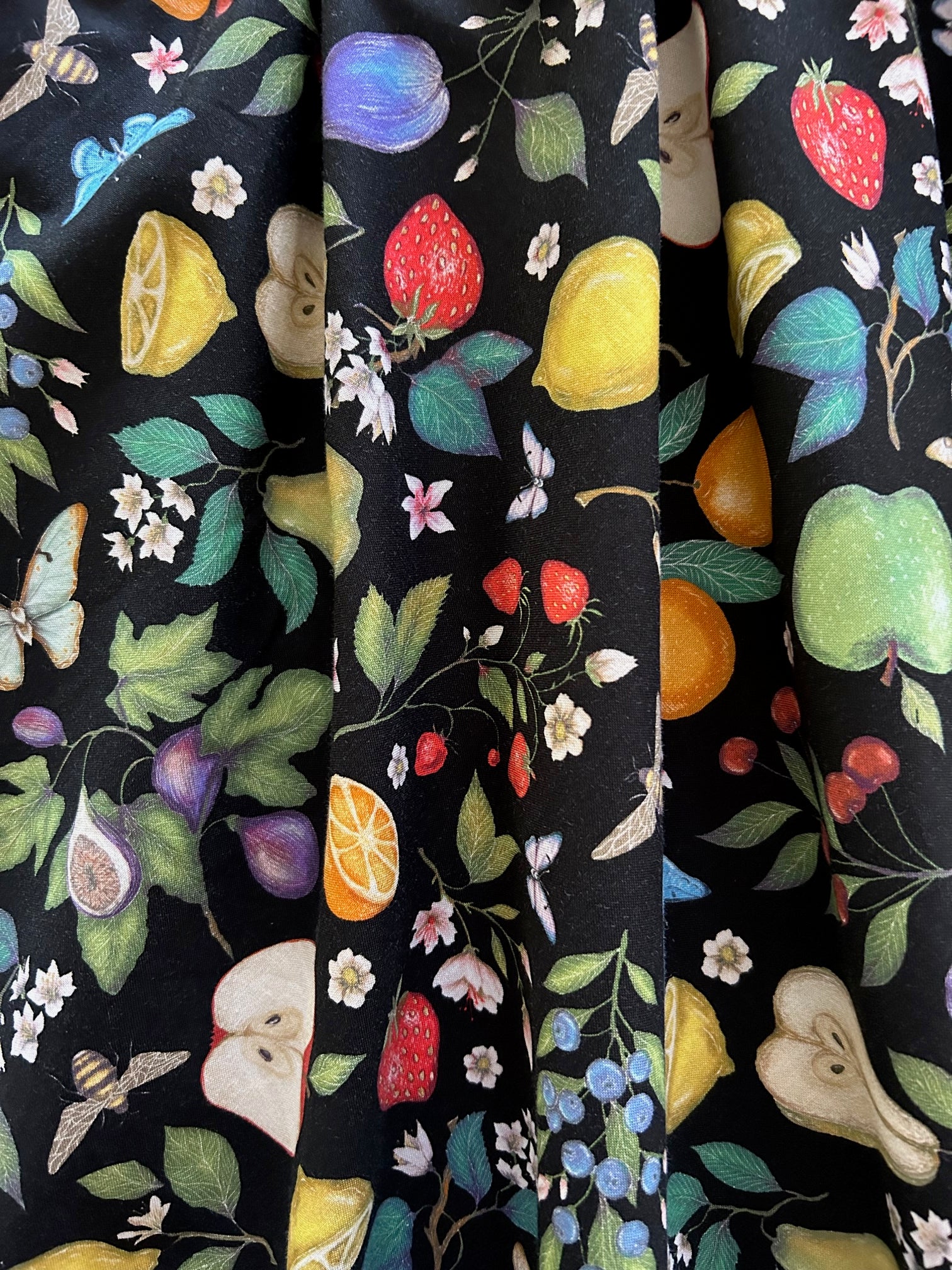 a close up of fabric of butterflies vintage dress