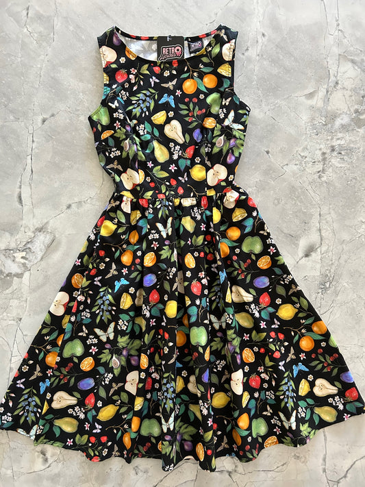 a flat lay of the fruits and butterflies vintage dress