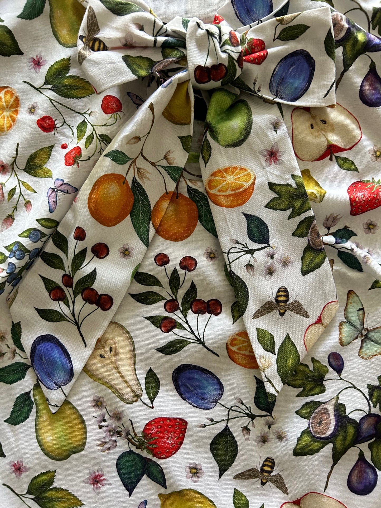 a close up of our fruits and butterflies bow top