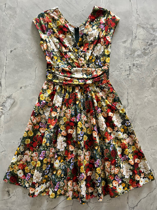 a flat lay of the dreamy floral greta dress