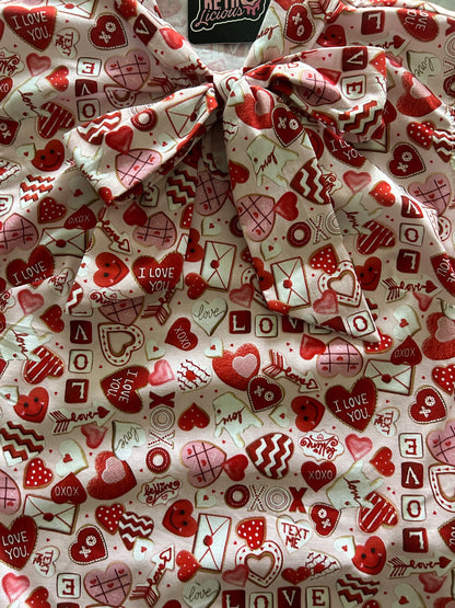 a close up of our xoxo bow top