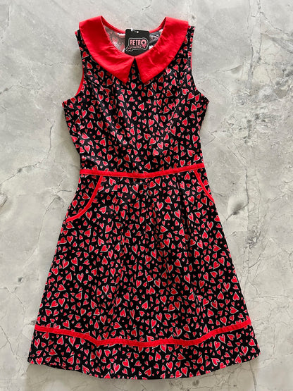 a flat lay of hearts collared dress