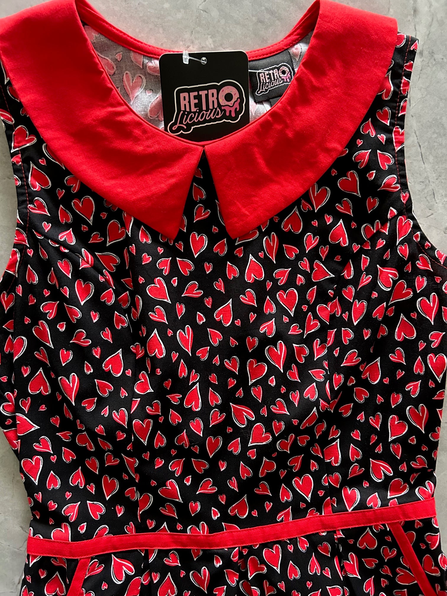 a close up of bodice of hearts collared dress