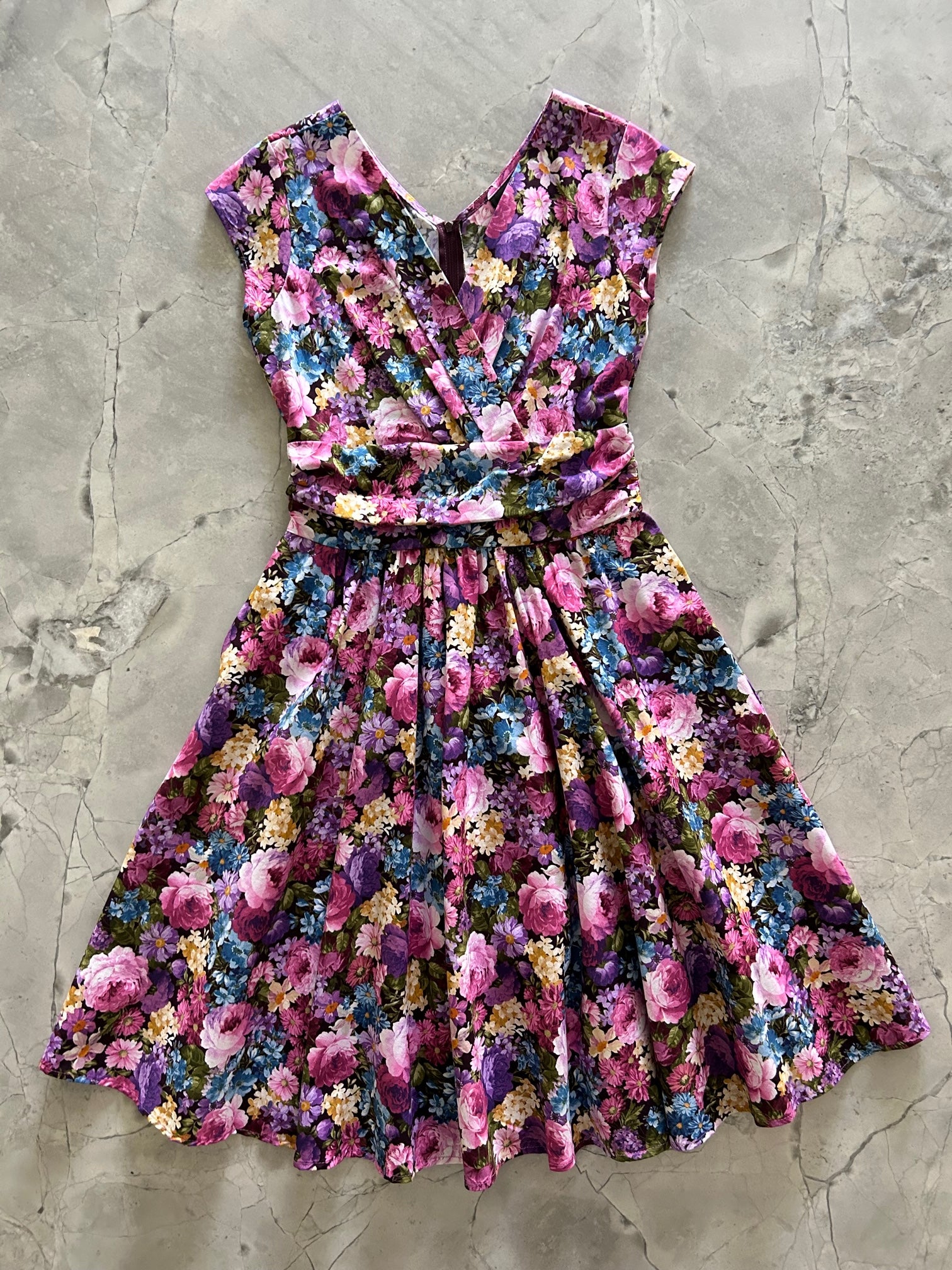 a flat lay of the vintage floral greta dress