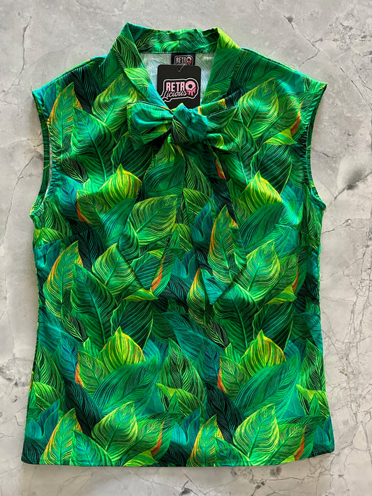 a flay lay of our bow tie blouse with leaves fabric