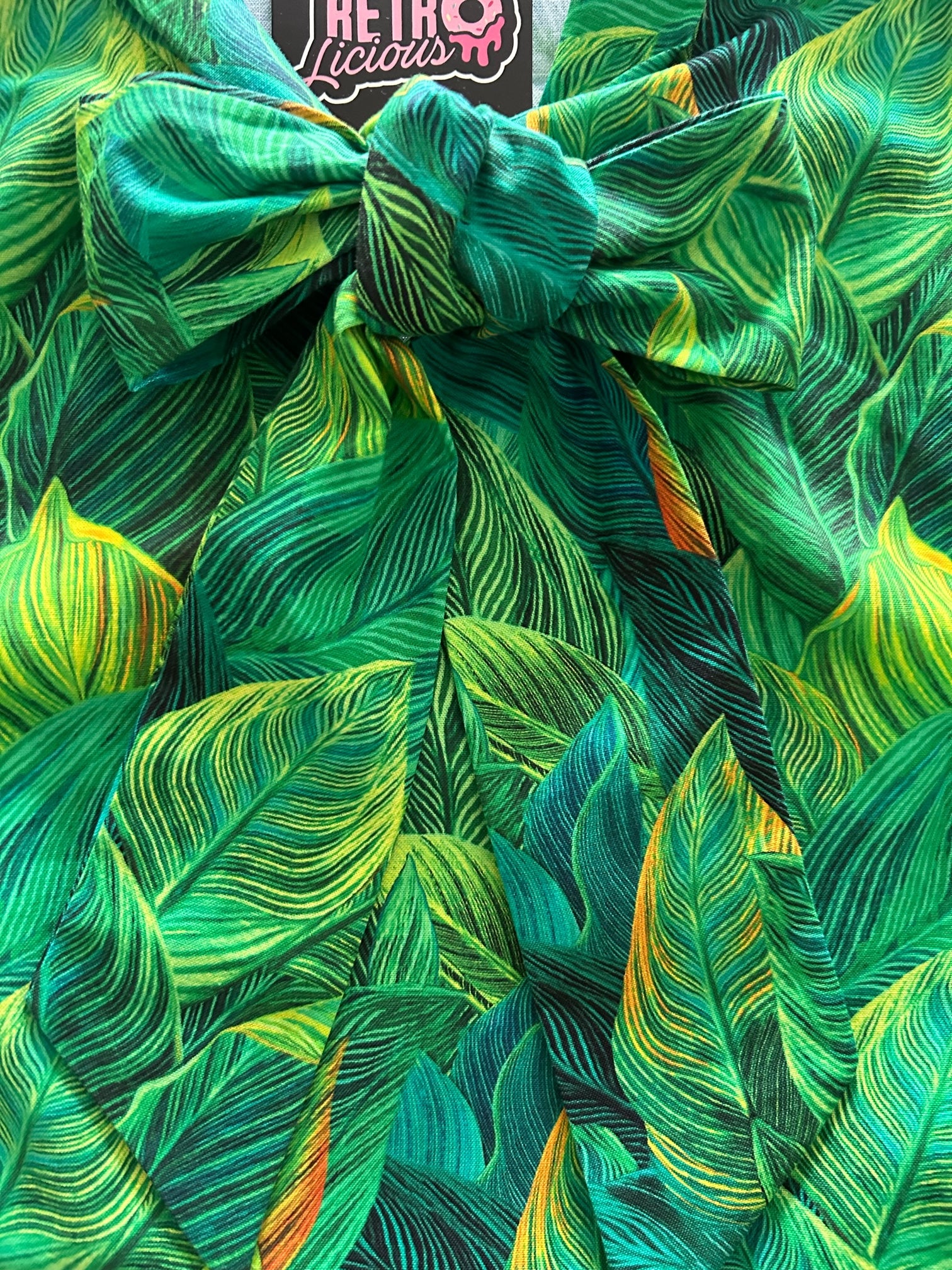 a close up of our leaves bow top