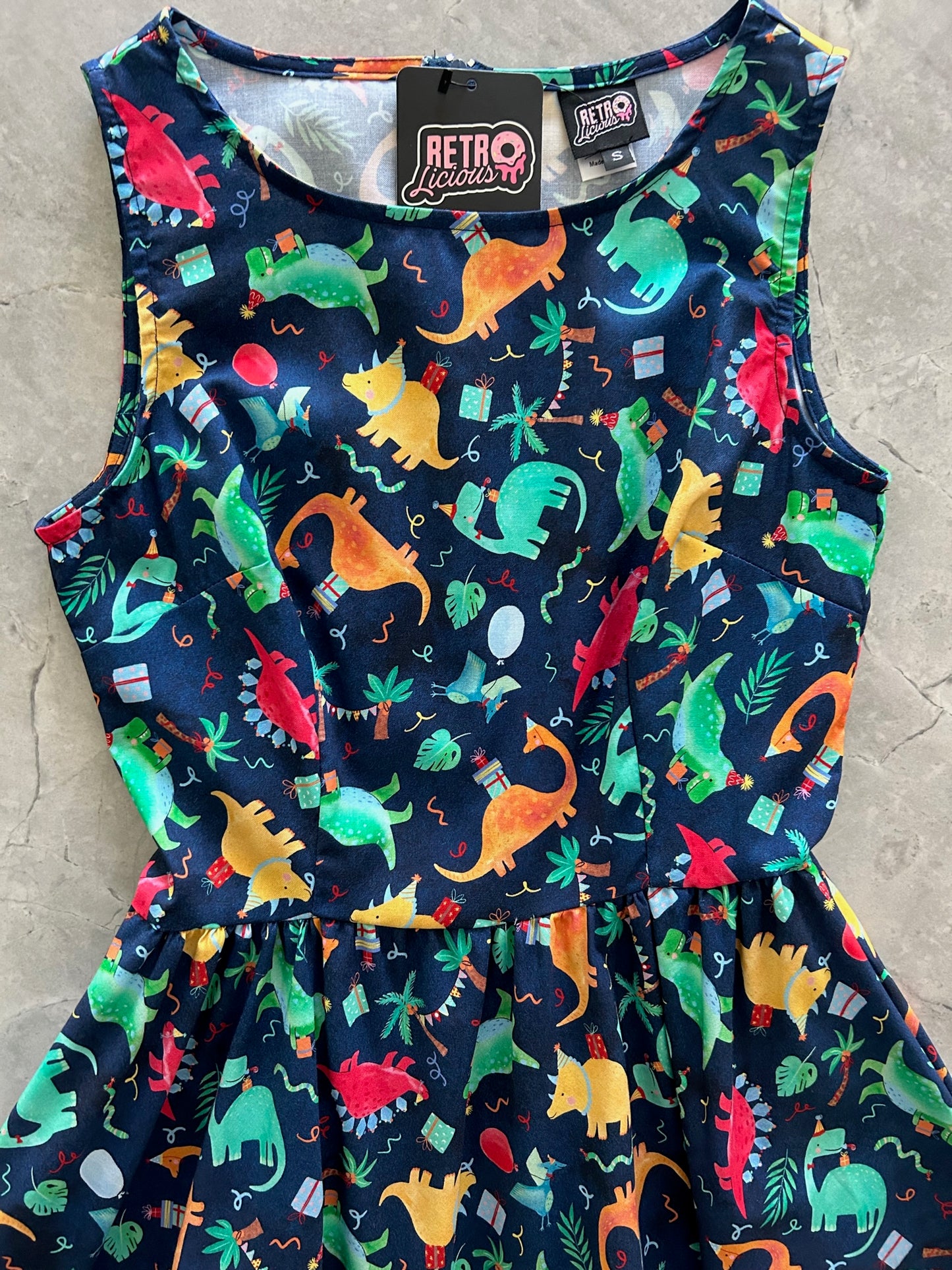 a close up of the front of the bodice of the party dinos vintage dress