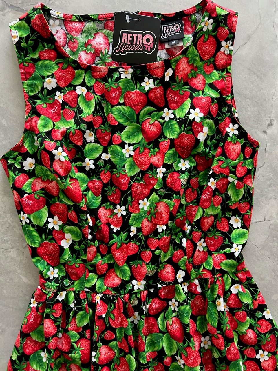 a flat lay of the bodice of the front of the strawberries midi dress