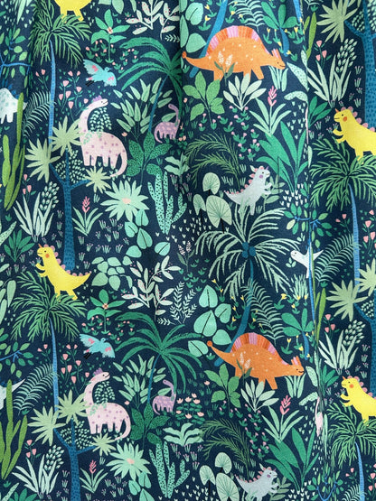 a fabric swatch of the dino shorter length fit and flare dress