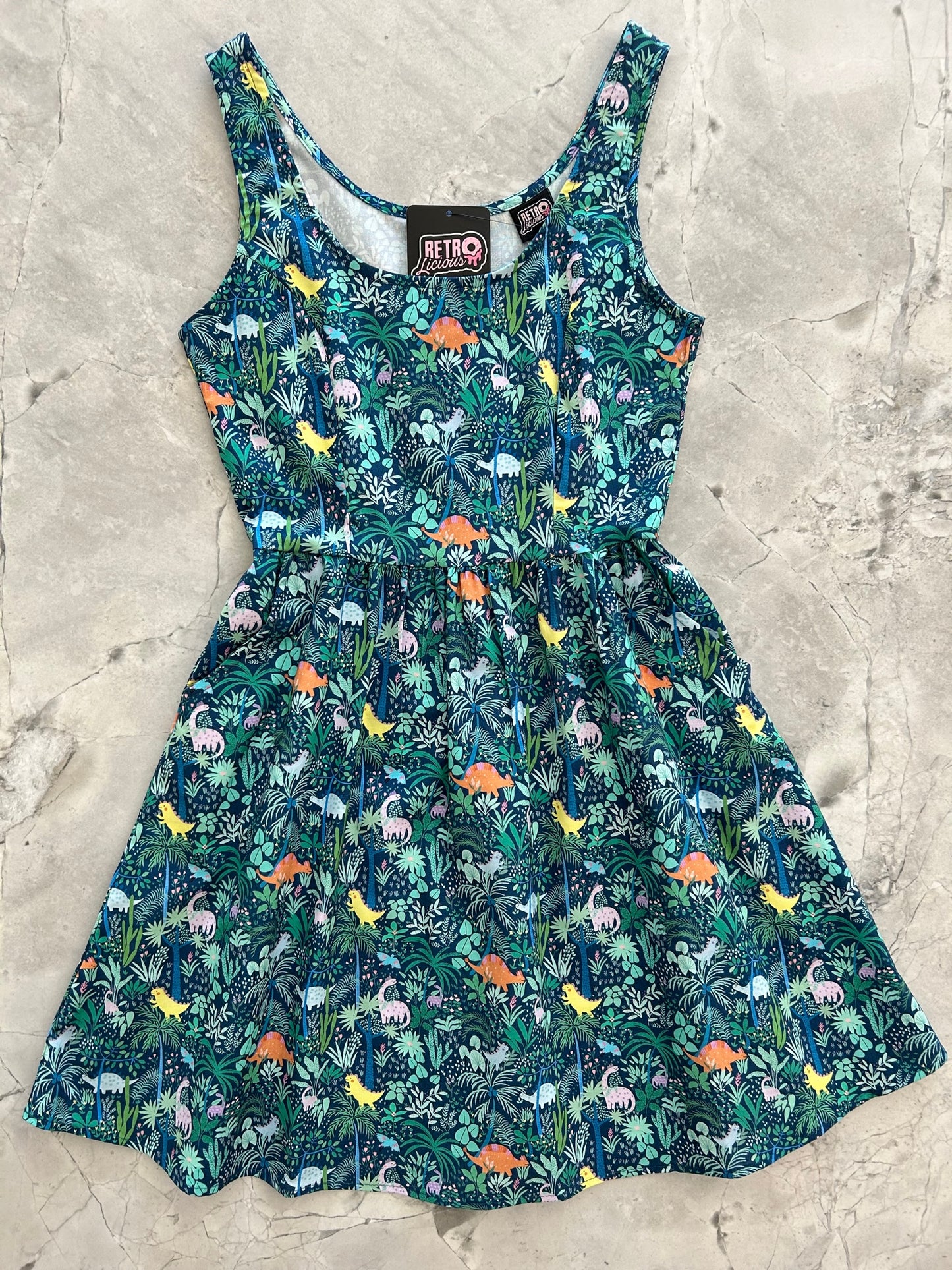 a flat lay of the front of the dino shorter length fit and flare dress