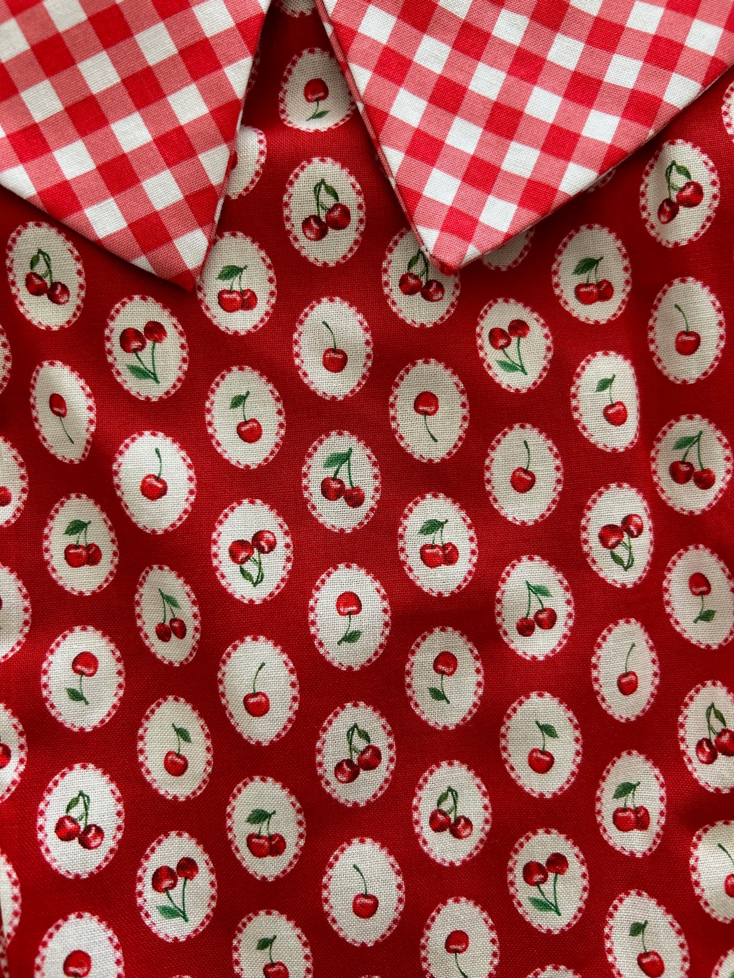 a close up of the cherry on top collared dress