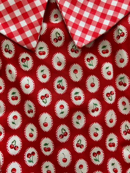 a close up of the cherry on top collared dress
