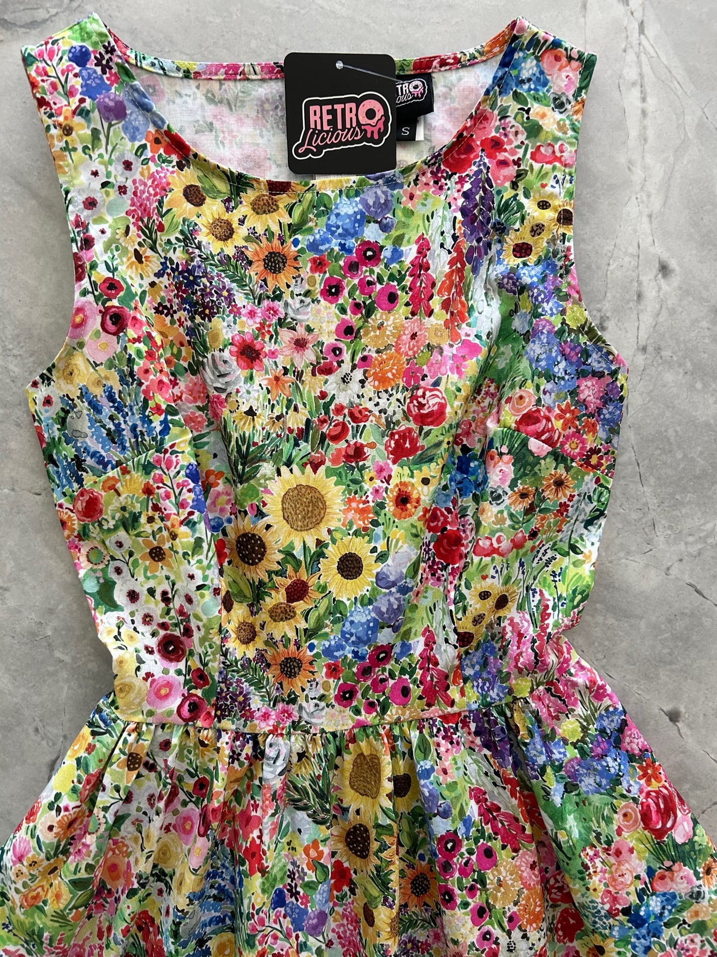 a flat lay of chasing the sun vintage dress