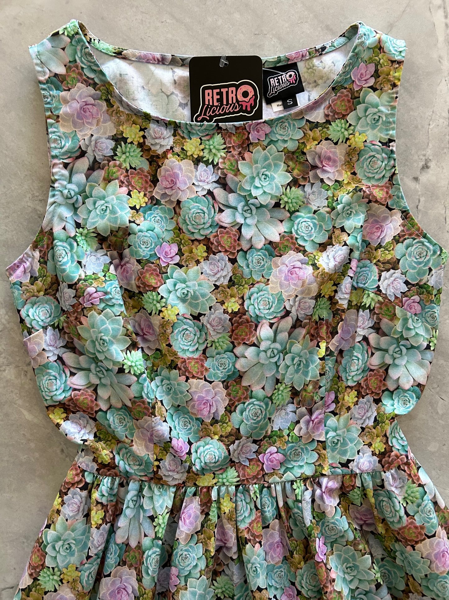a flat lay of the bodice of the succulent vintage dress