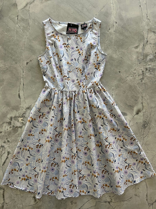 a flat lay of the front of the pollinators vintage dress