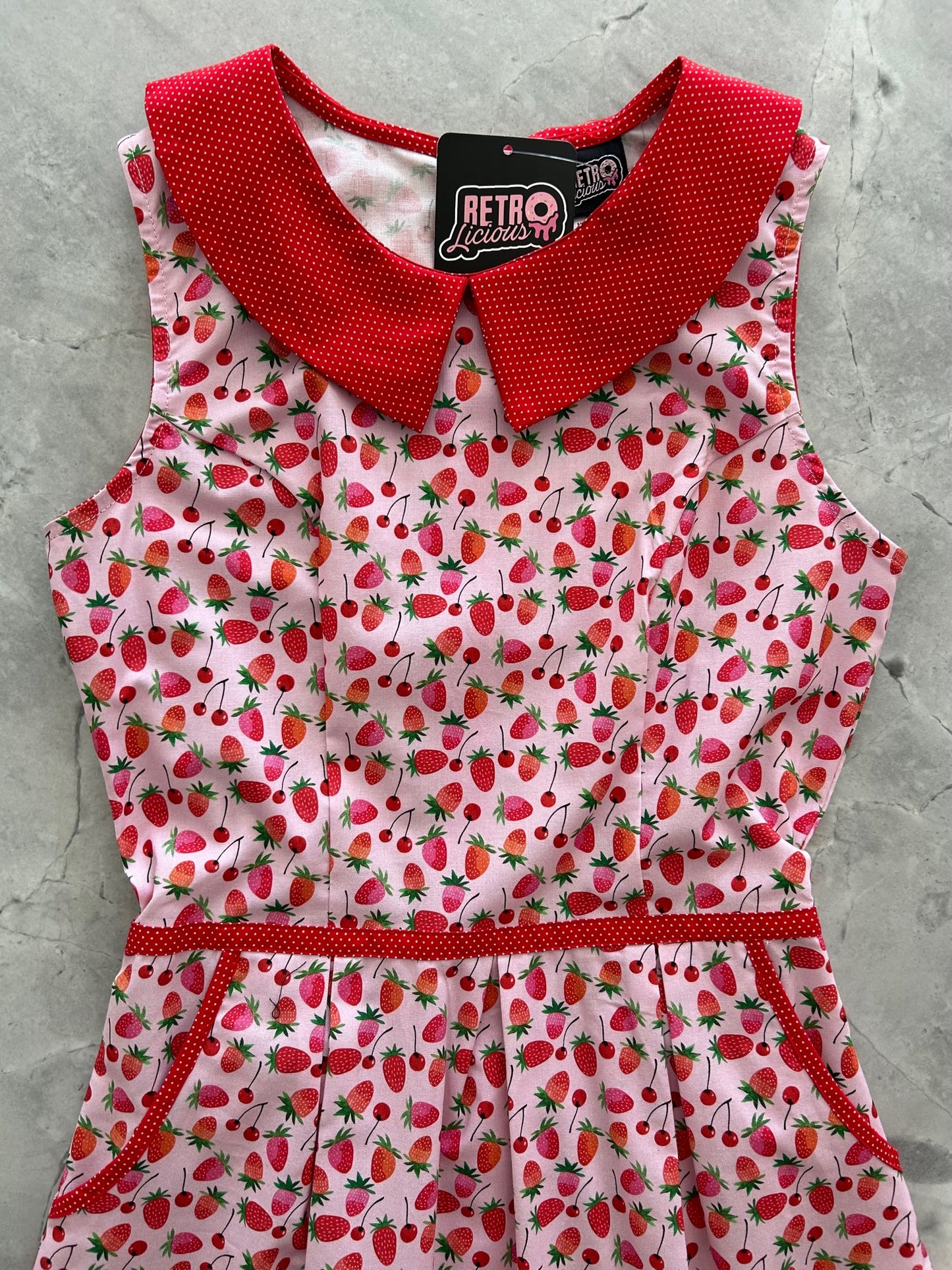 a flat lay of the bodice of the berry cherry collared dress
