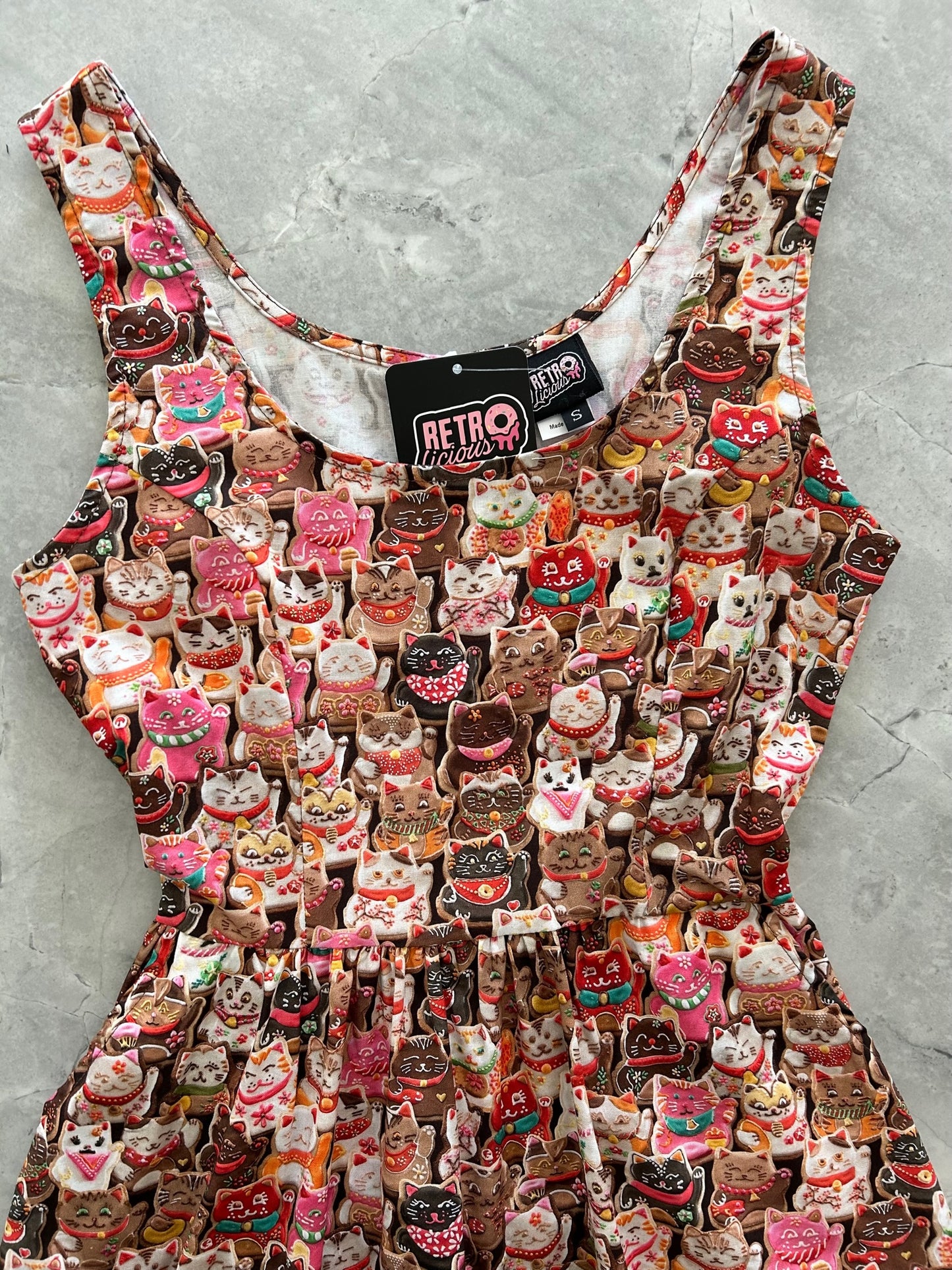 a close up of the bodice of the front of the cookie cats shorter length fit & flare dress