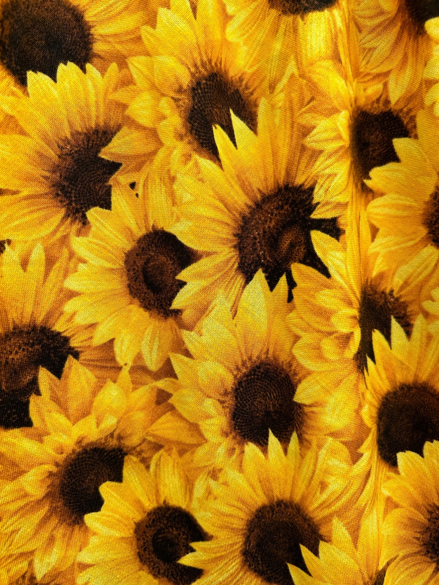 a close up of the fabric of the sunflower vintage dress