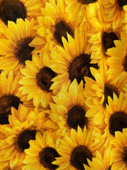 a close up of the fabric of the sunflower vintage dress