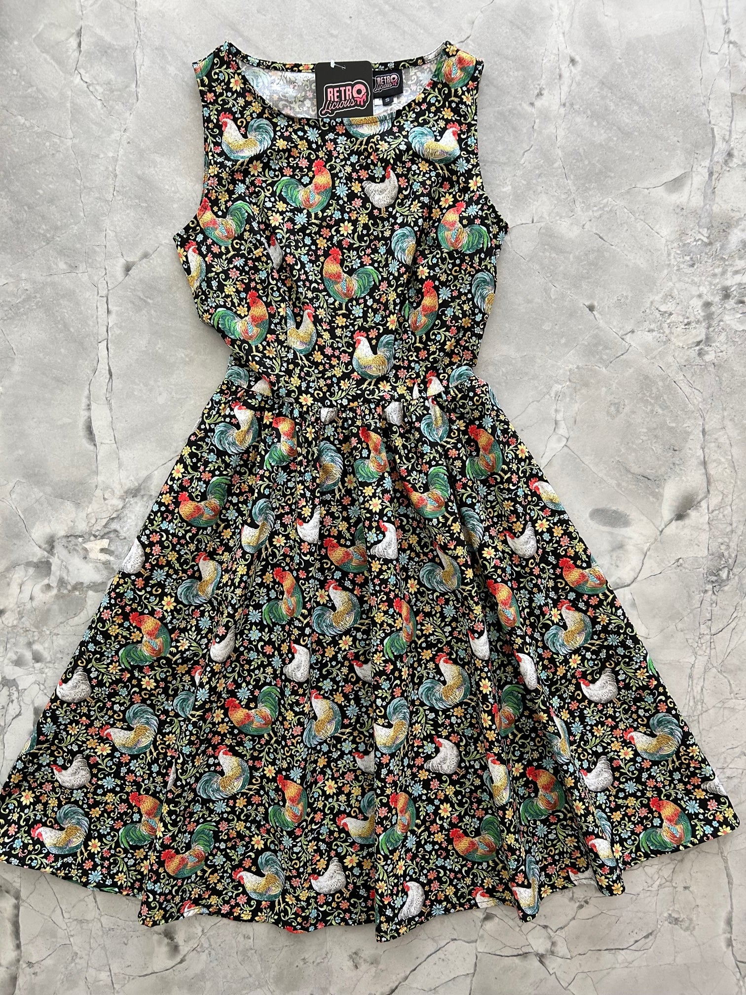 a flat lay of the front of the chicken vintage dress