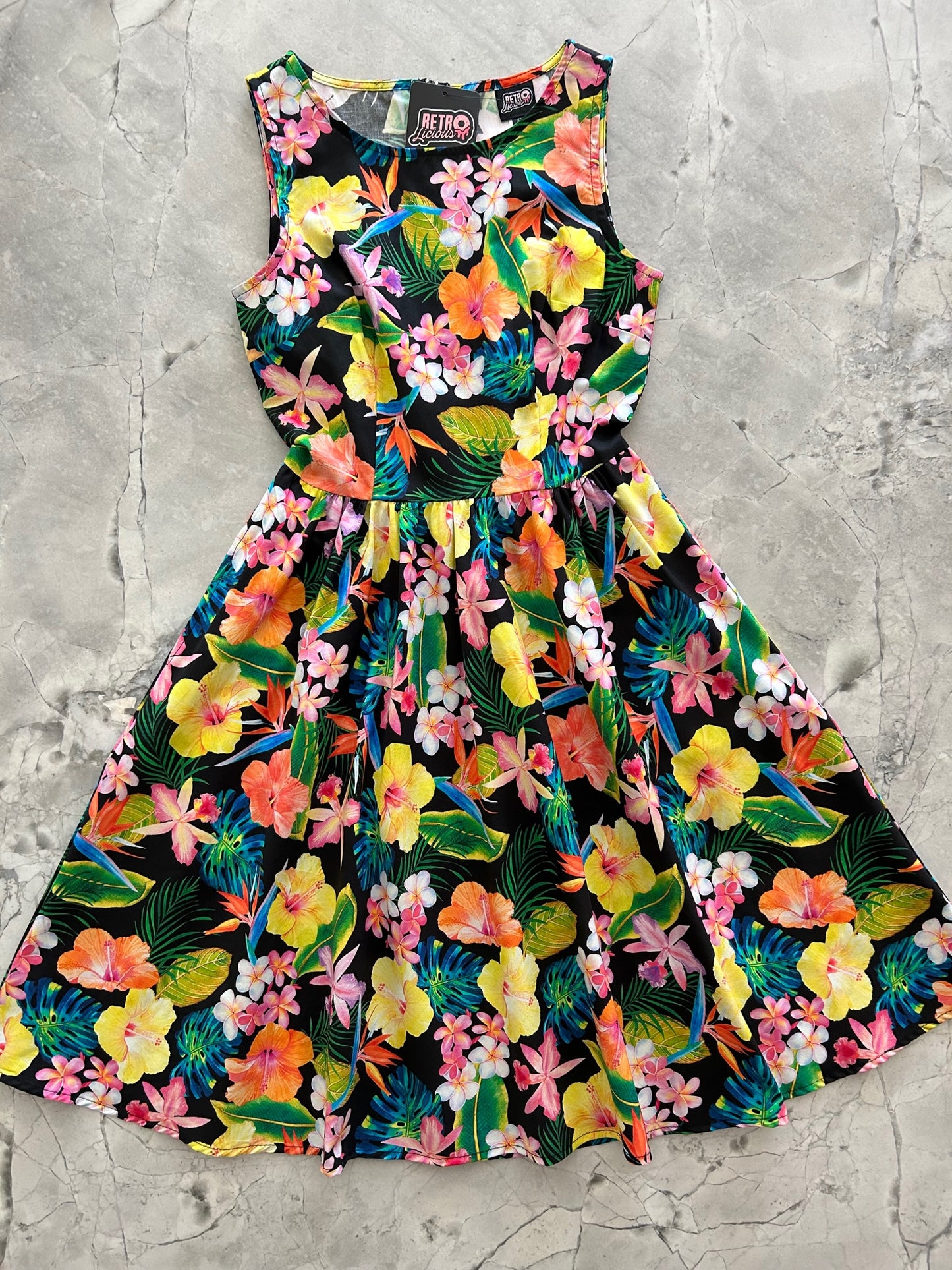 a flat lay of the front of the tropical vintage dress