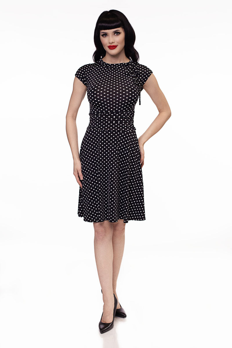 a full size image of a model wearing the bridget bomshell polka dot dress