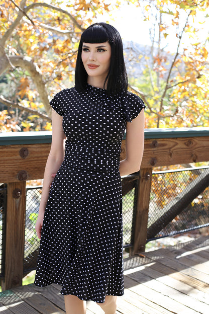 a model standing outdoors wearing a bridget bomshell dress