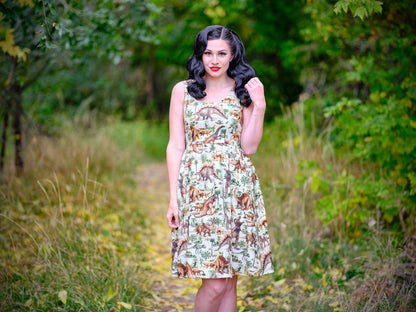 a model standing in front of trees wearing the prehistoric dress the background is blurred