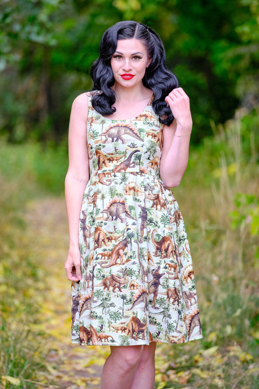 a model standing in front of trees wearing the prehistoric dress the background is blurred