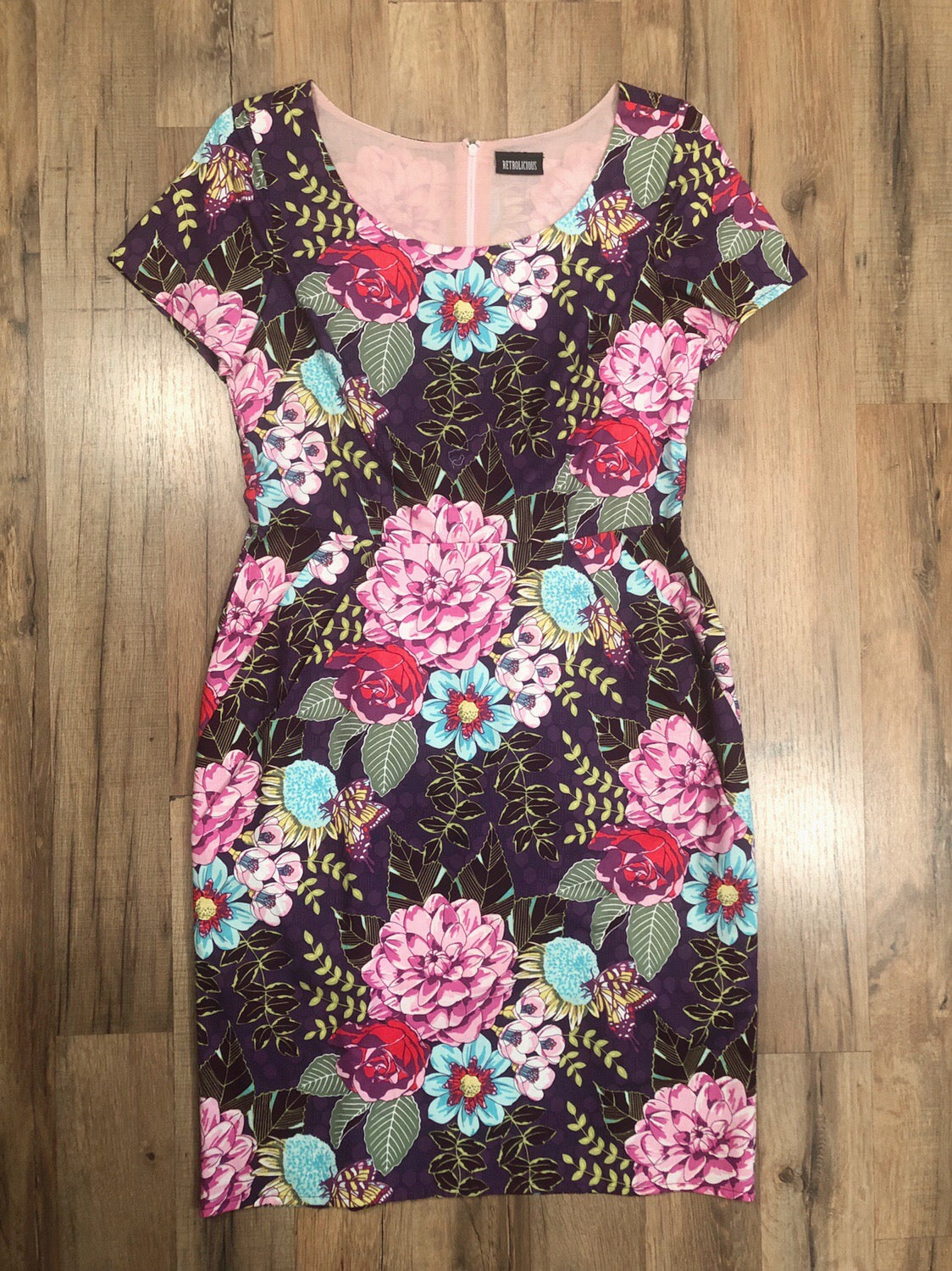 flat lay of mod purple floral dress