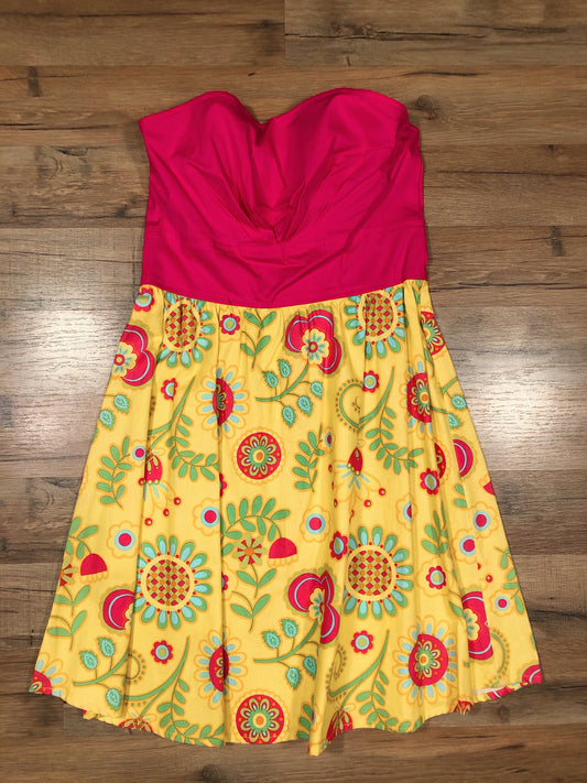 a flat lay of strapless sunshine dress