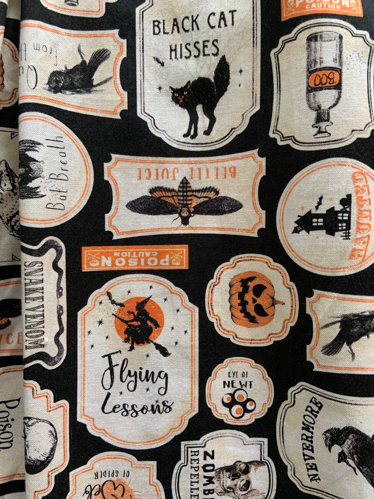 a close up of the fabric showing the print up close of our margaret dress in halloween print