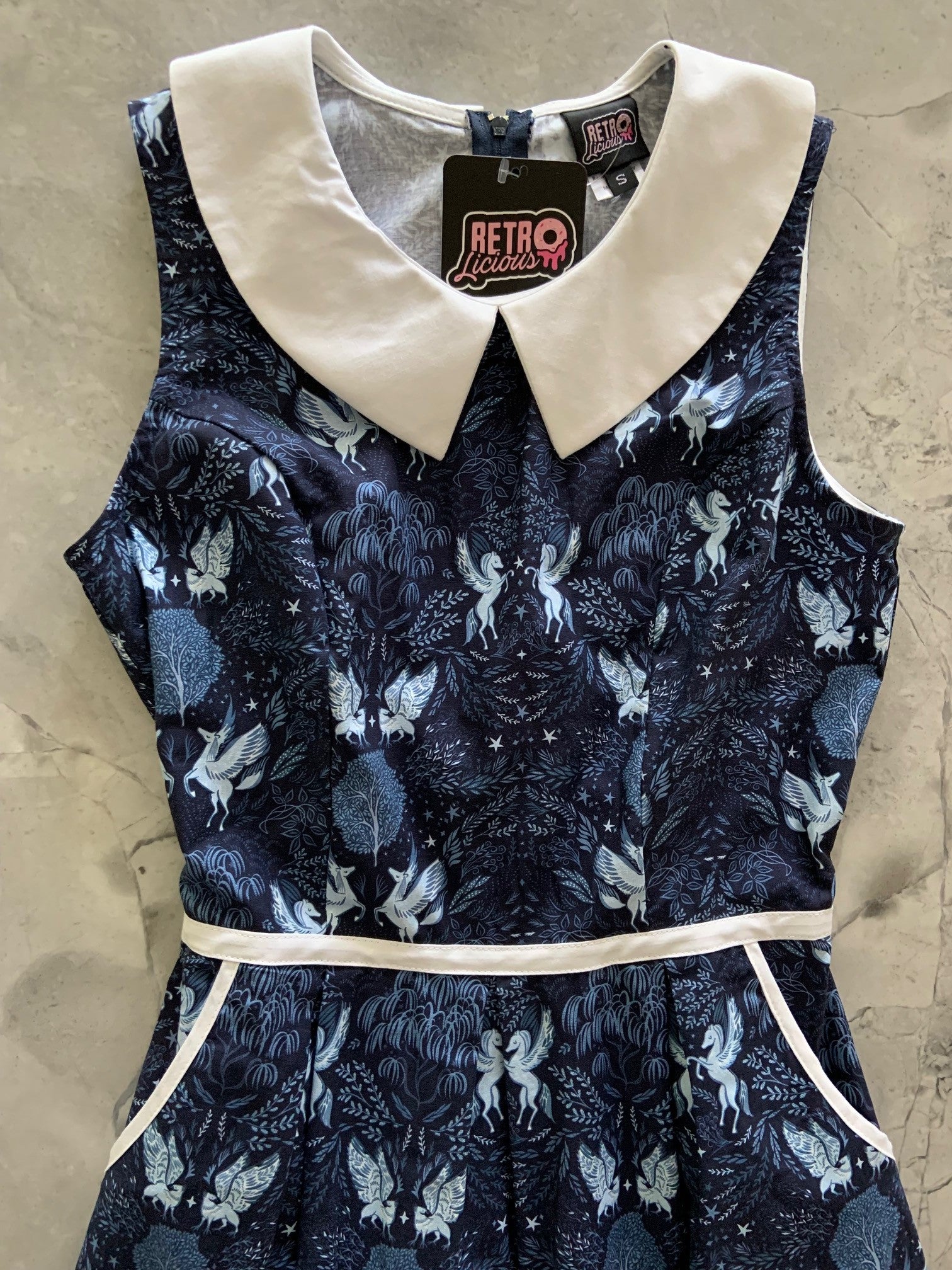 a flat lay of midnight collared dress