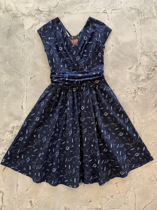 a flat lay of a sky full of stars greta dress