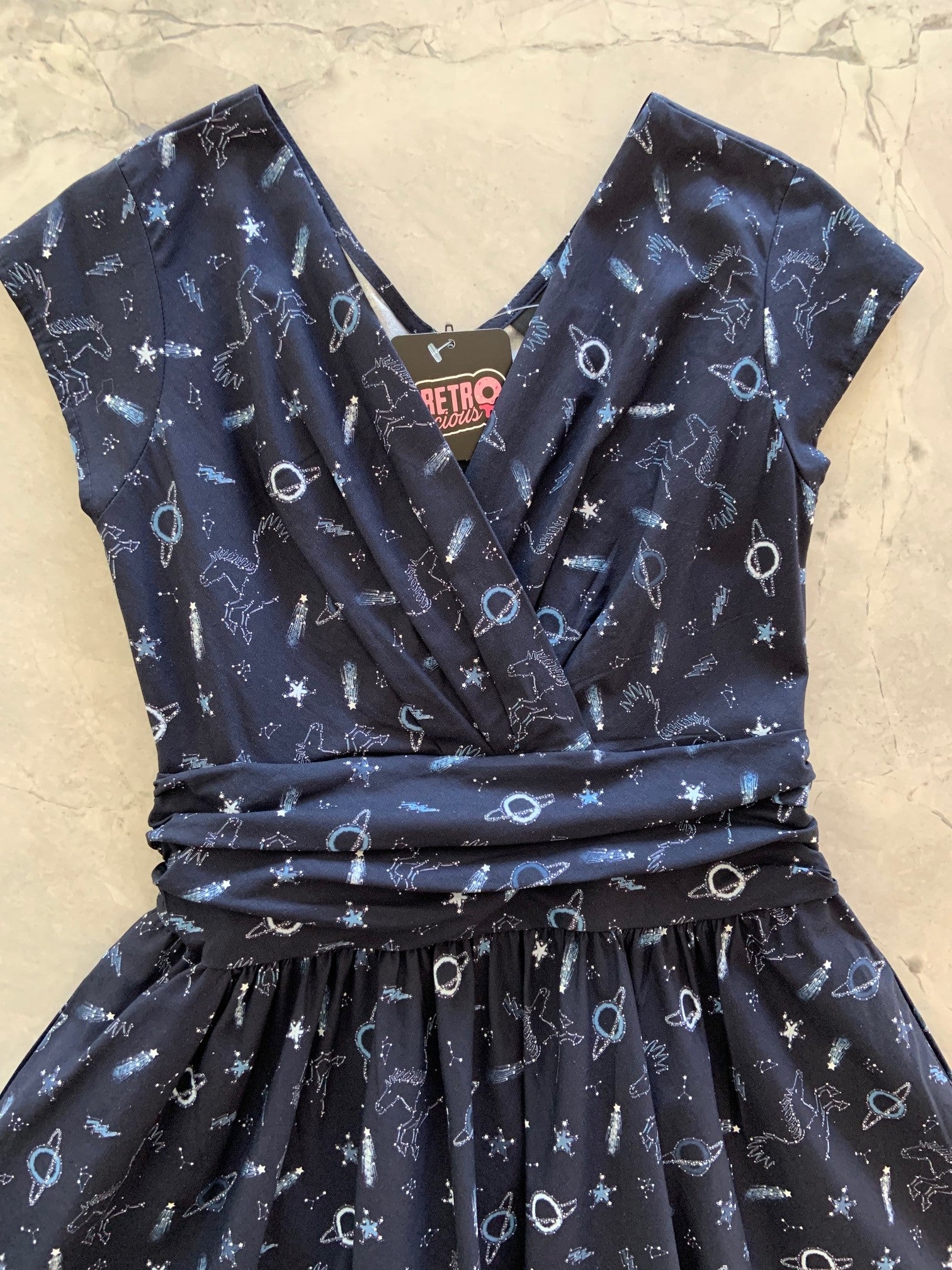a flat lay of a sky full of stars greta dress