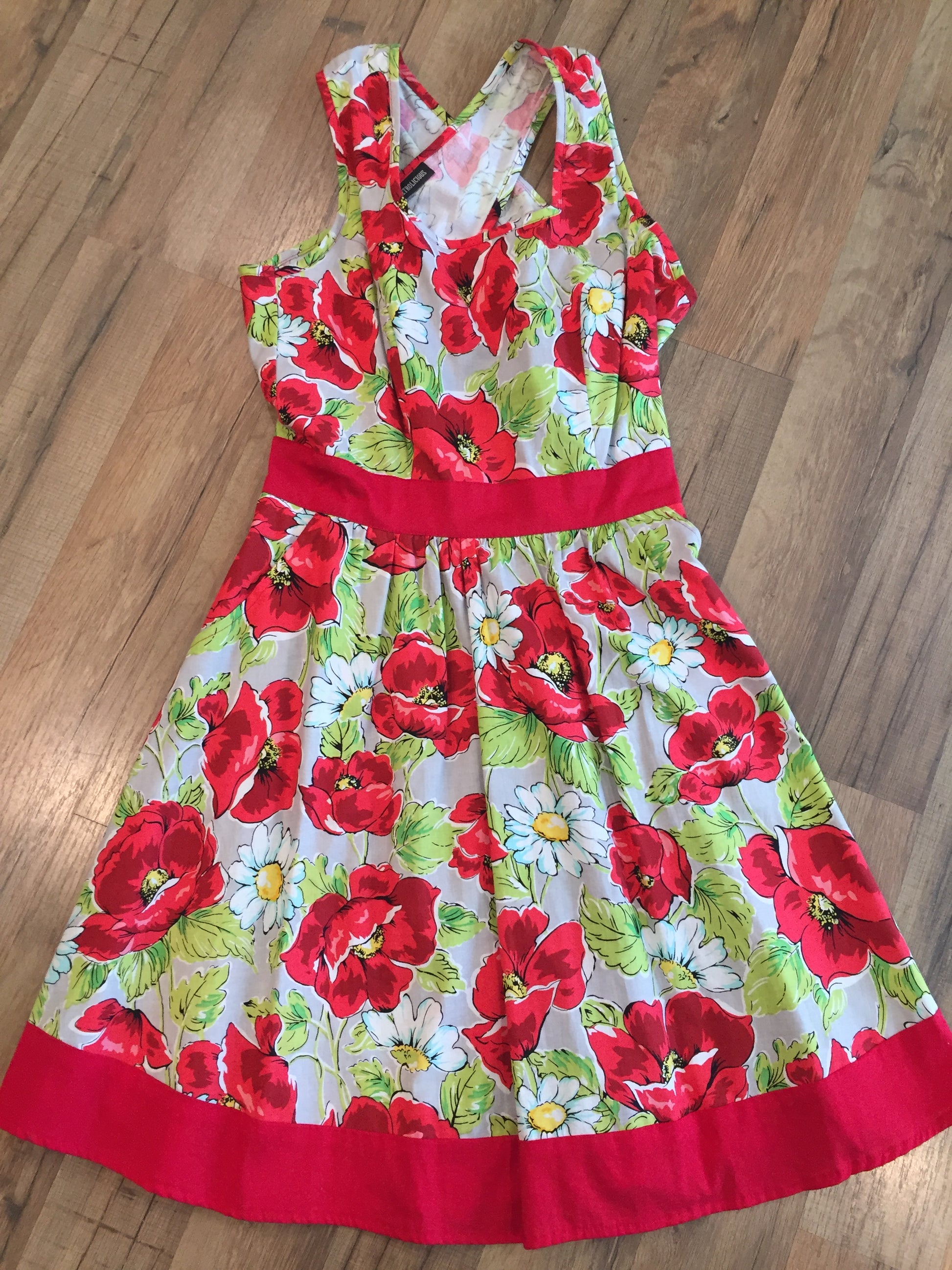flat lay of floral cross back dress