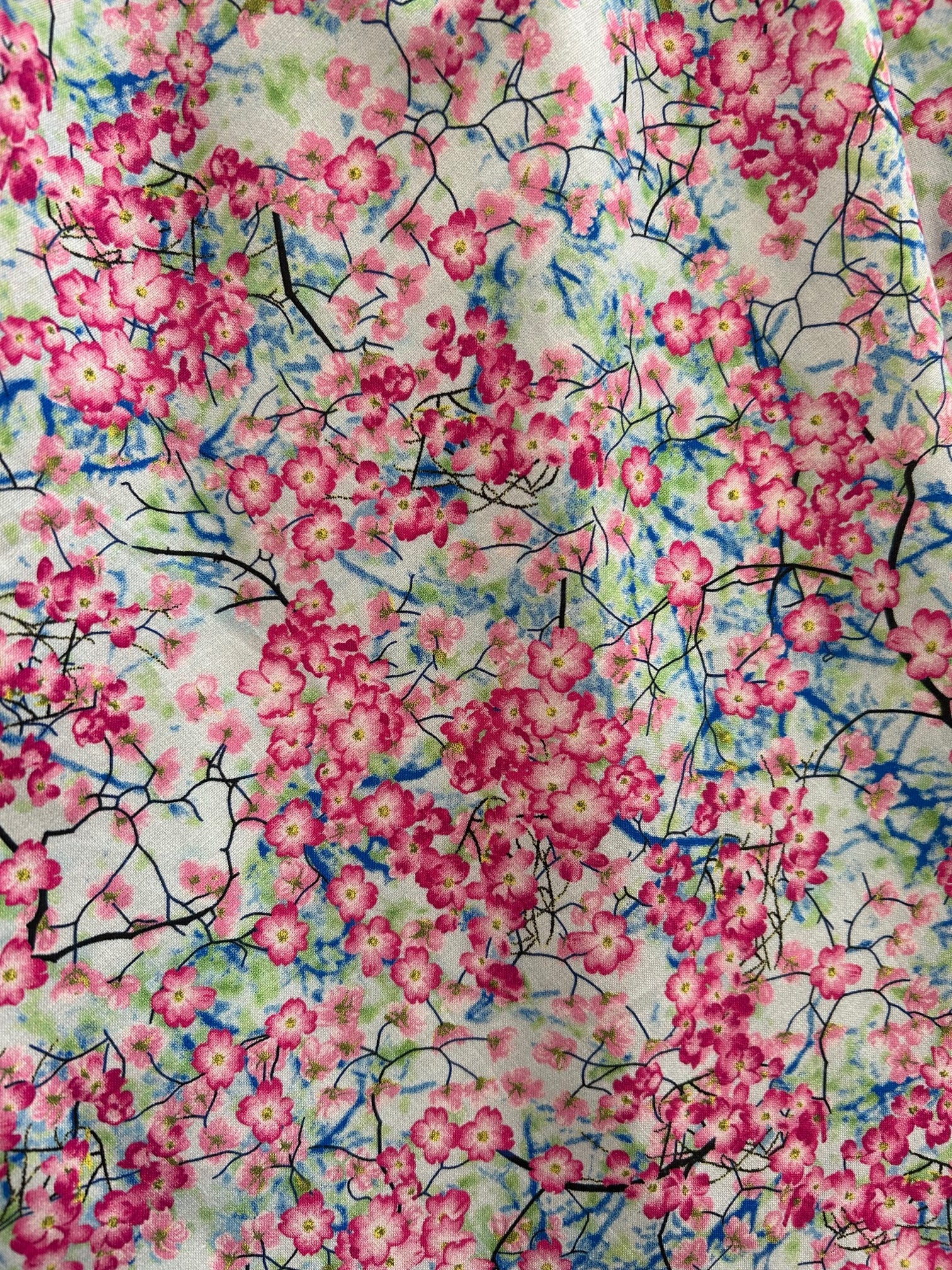 a close up of the fabric of the cherry blossom greta dress