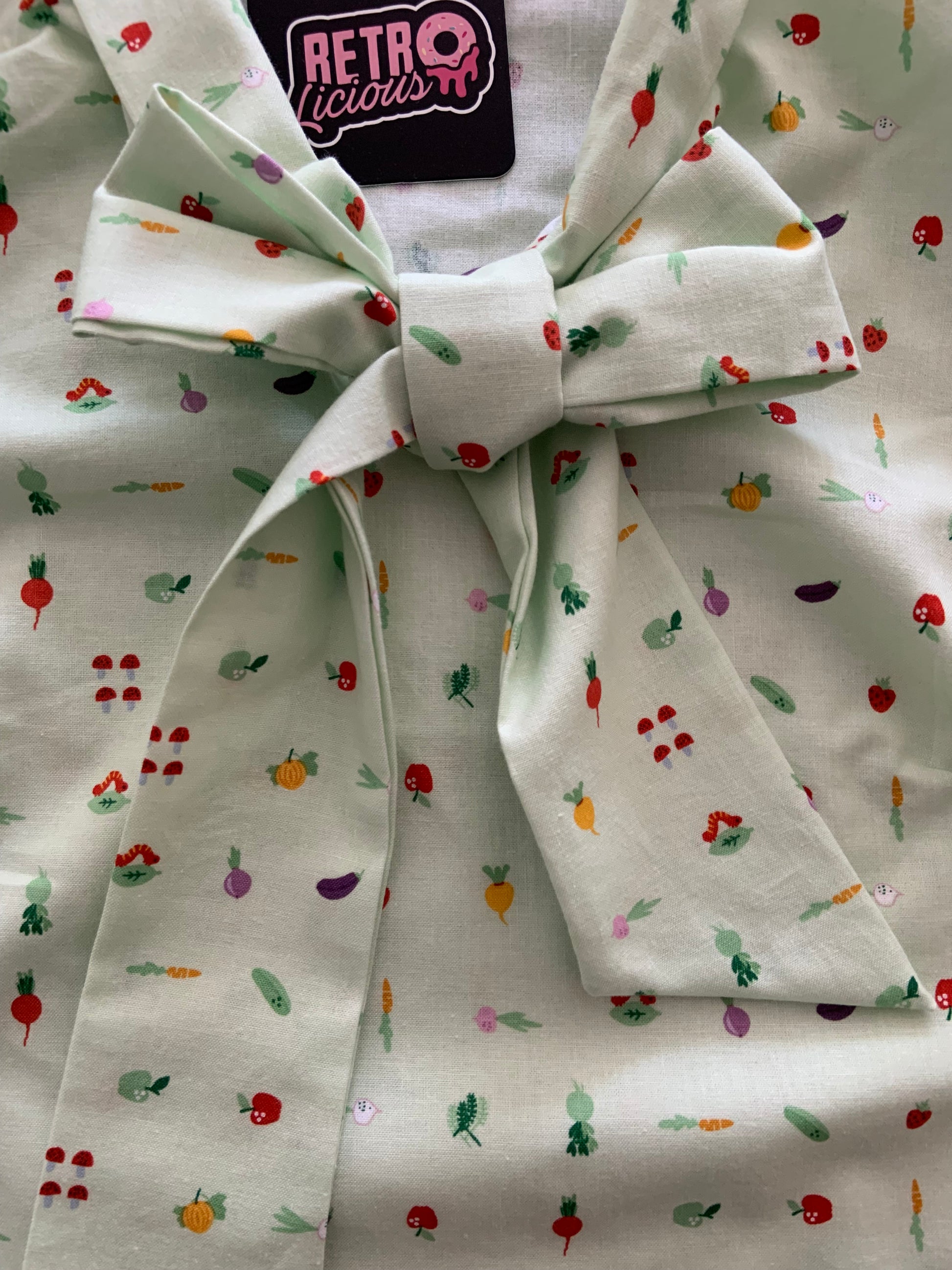 a close up of our veggies bow top