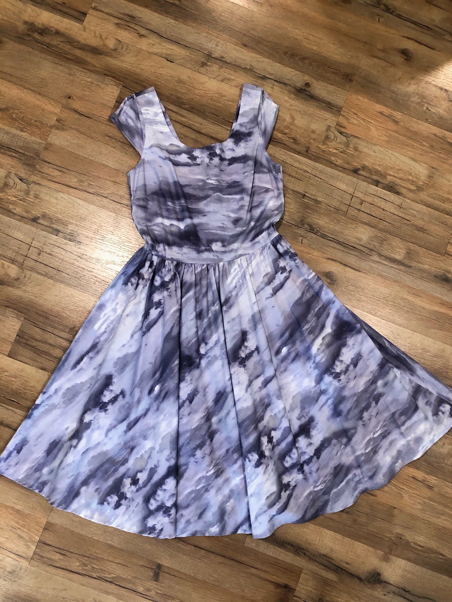 a flat lay of cloudy skies swing dress