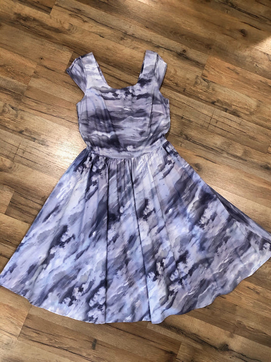 a flat lay of cloudy skies swing dress