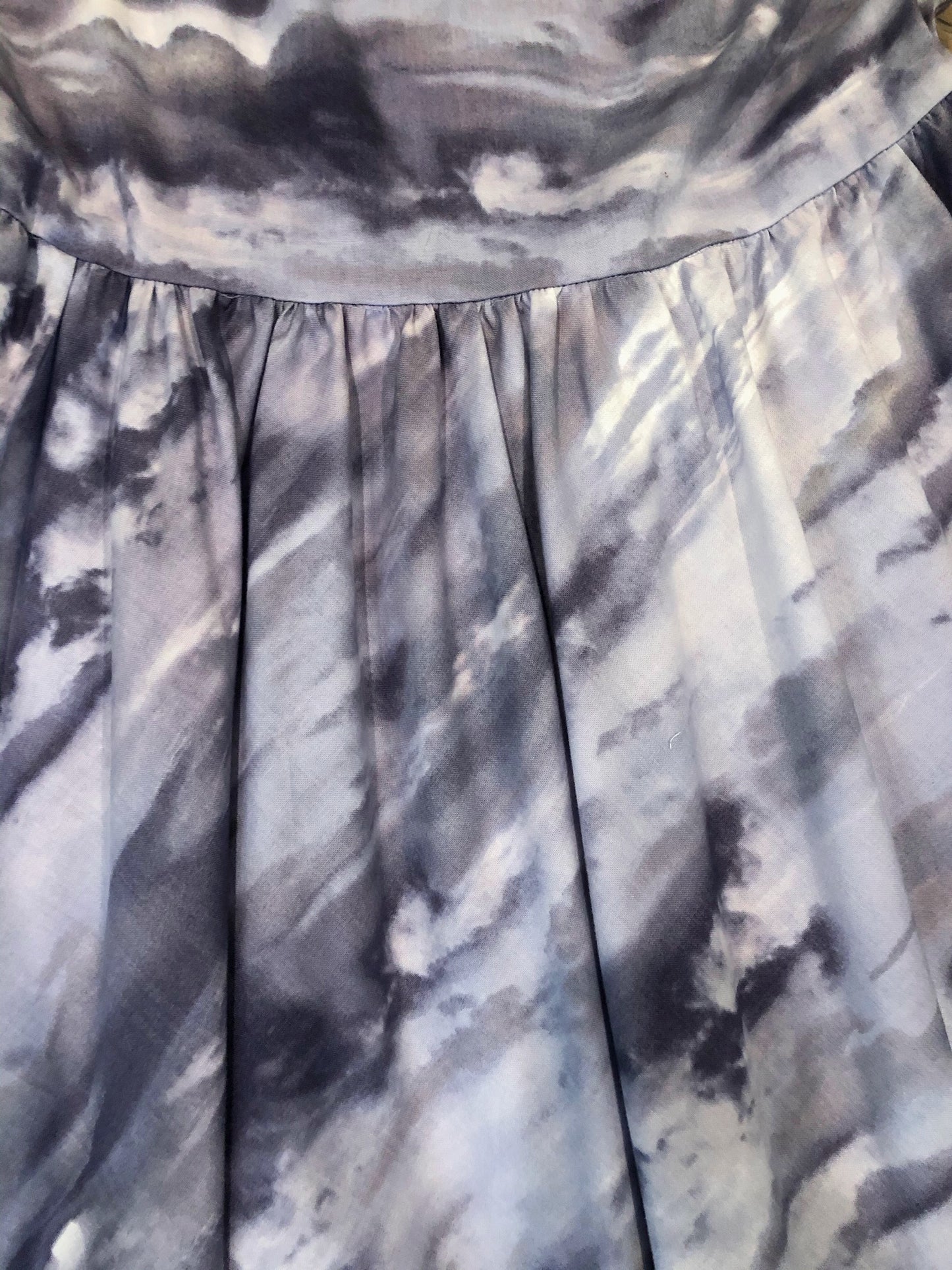 a close up of cloudy skies fabric showing the clouds