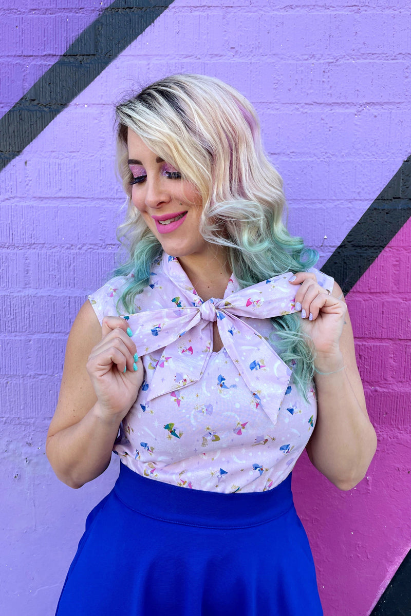 a close up of a model wearing our three good fairies bow top