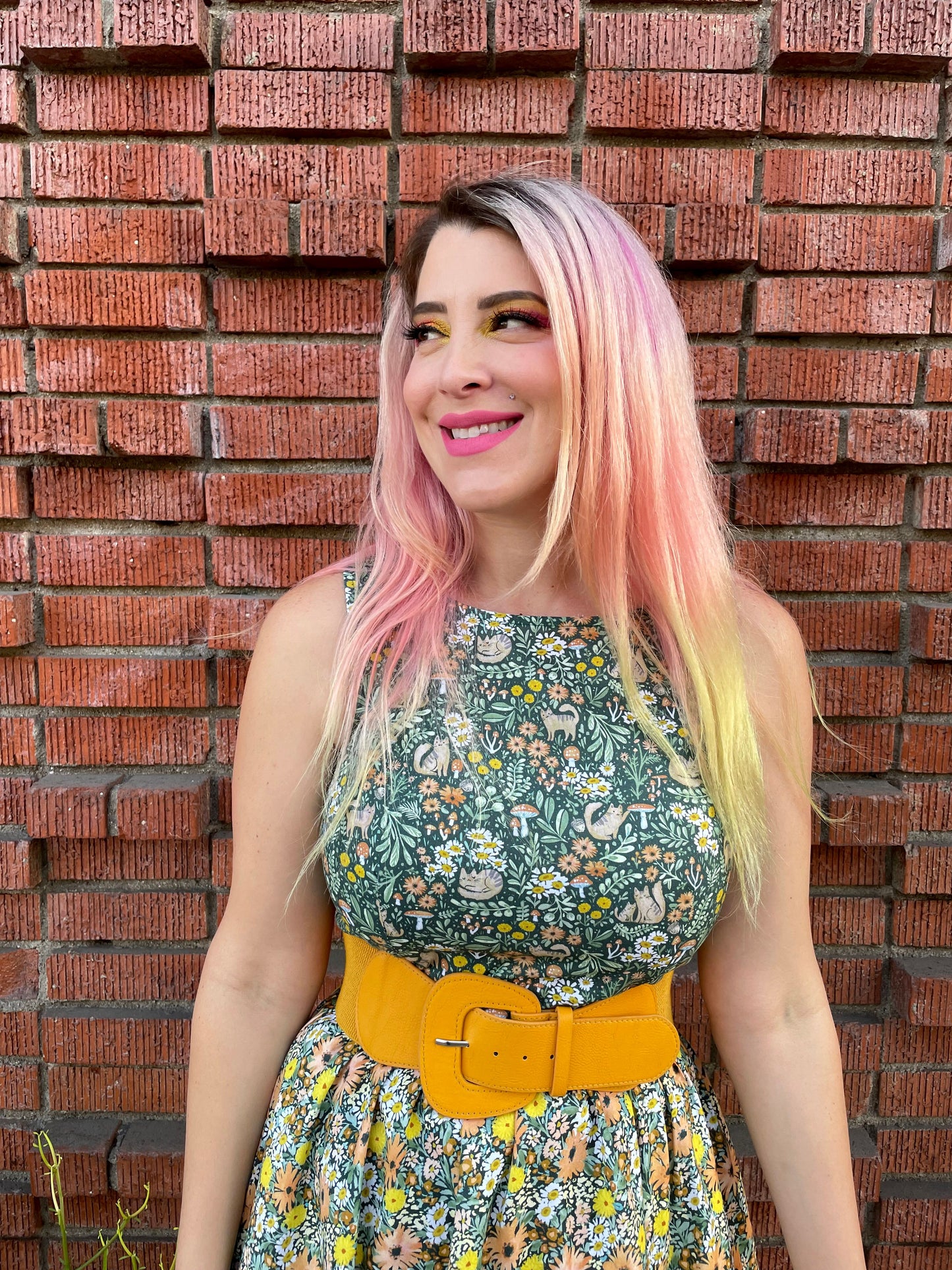 a close up image of a model standing in front of a brick wall wearing the cats in the fields twofer dress