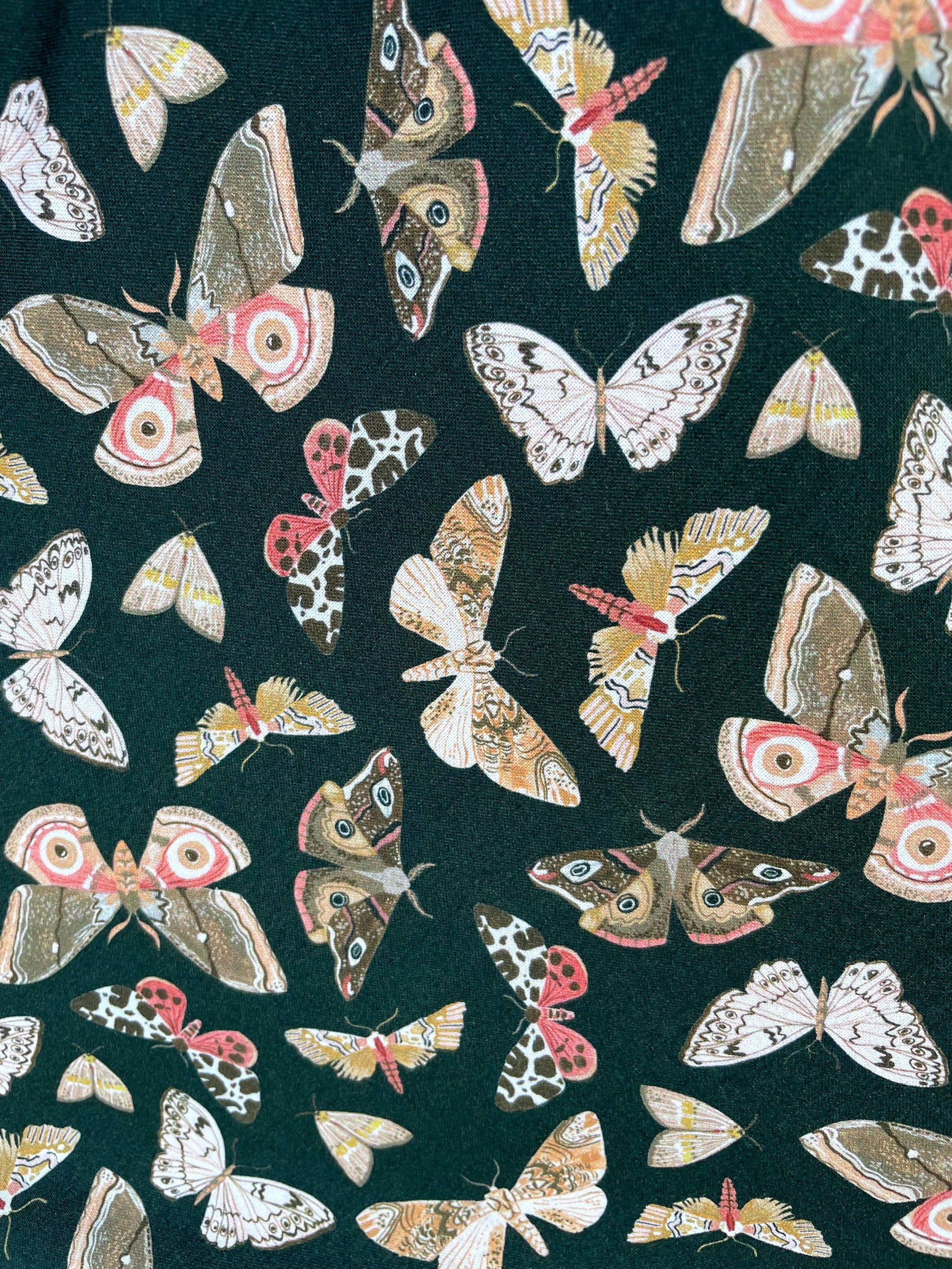 a close up of the fabric of the butterfly vintage dress