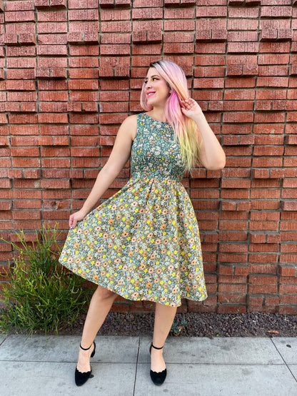 a full size image of a model standing in front of a brick wall wearing the cats in the fields twofer dress