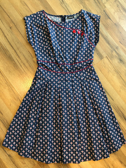 a flat lay of navy floral dress